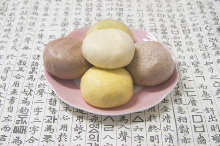 The five cardinal colors steamed bun with red bean paste fillingの写真素材