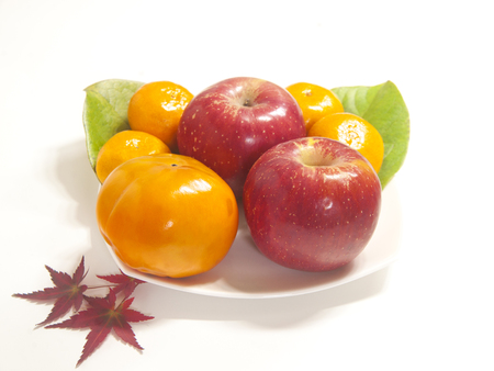 fruit, apple, mandarin, persimmon, maple leaf, autumnの写真素材
