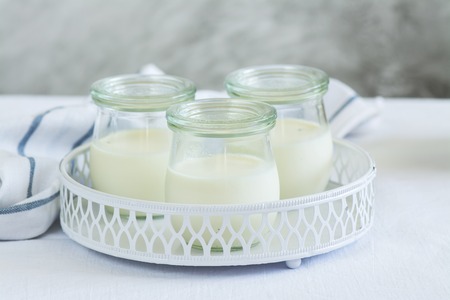 Healthy homemade vanilla dessert in glass jars. Selective focusの写真素材