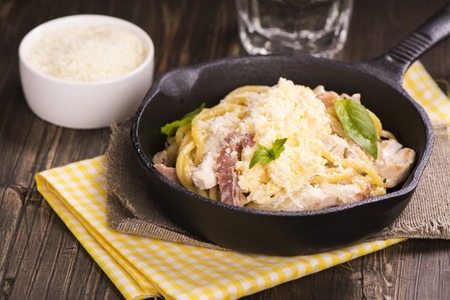 Pasta with bacon, chicken, parmesan and scrambled egg. Selective focusの写真素材