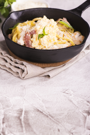 Pasta with bacon, chicken, parmesan and scrambled egg. Selective focusの写真素材