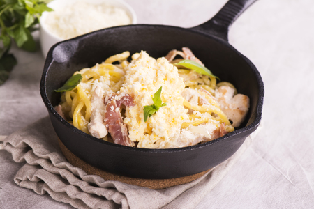 Pasta with bacon, chicken, parmesan and scrambled egg. Selective focusの写真素材