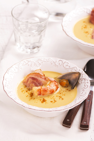 Delicious cream chowder with bacon, shrimps and musselsの写真素材