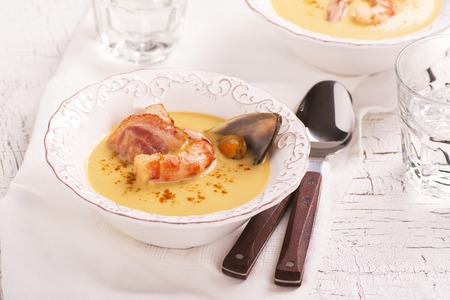 Delicious cream chowder with bacon, shrimps and musselsの写真素材