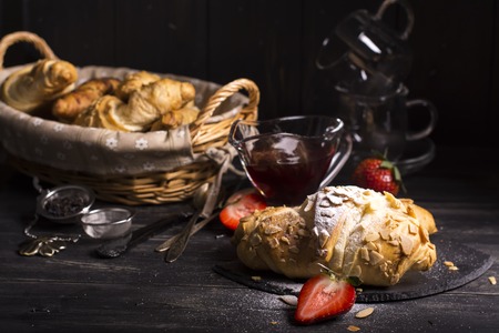 Fresh almond croissants strewing by sugar powder, vintage style.の写真素材