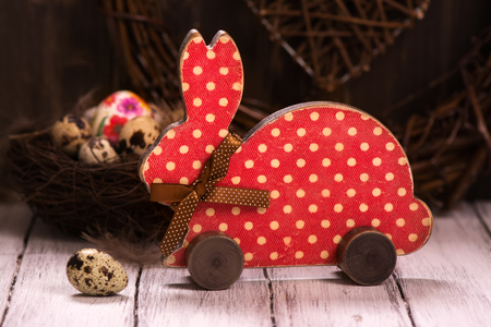 Easter card with wooden bunny. Toned image. Selective focusの写真素材