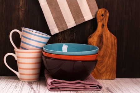 Kitchen cooking utensils with napkins over wooden table. Selective focus. Vintage styleの写真素材
