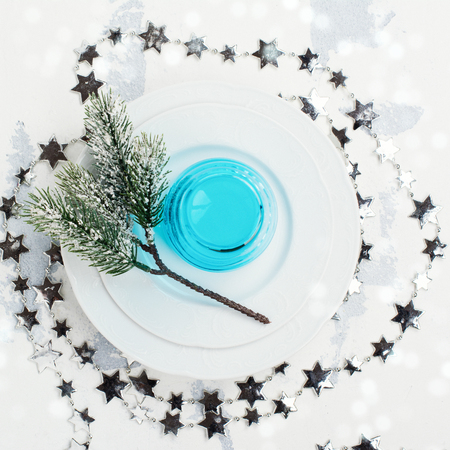 Christmas table setting over white stone tableの写真素材
