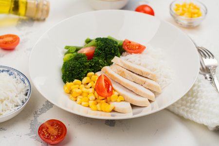 Balanced meal or diet concept. Chicken with rice and vegetablesの写真素材
