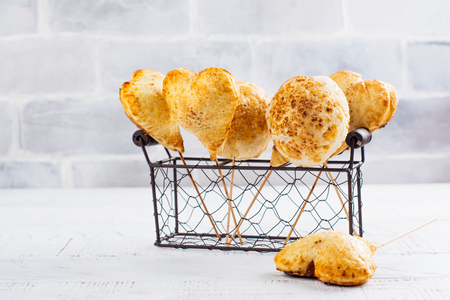 Homemade apple pie cake pops in vintage wire basket. Copy spaceの写真素材
