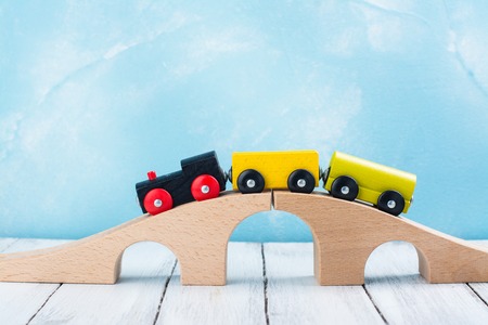 Colorful wooden toy train on wooden tableの写真素材
