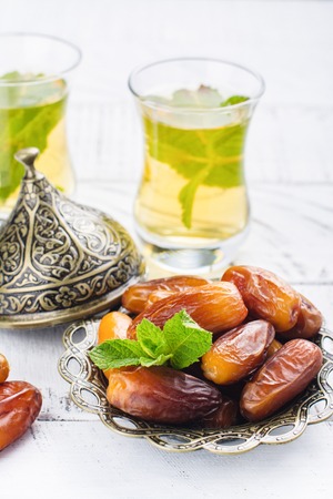 Dry dates and mint tea. Ramadan Kareem holiday conceptの写真素材