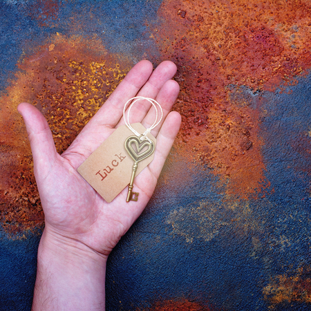 Good luck key on a human palm. Success concept. Space for textの写真素材