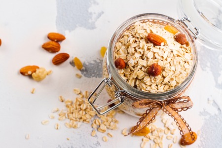 Oat meal in a glass jar. Healthy eating or breakfast concept. Copy spaceの写真素材