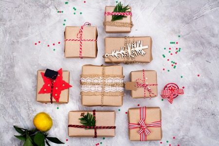 Many Christmas gifts on stone background. Winter holidays concept. Top viewの写真素材