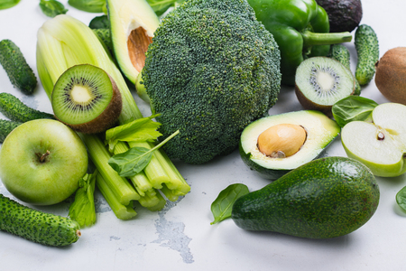 Green fruits and vegetables on white backgroundの写真素材