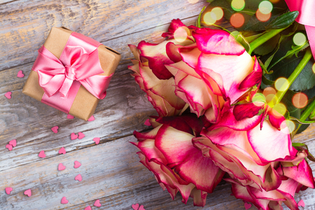 Beautiful roses on wooden background. Valentines day or mothers day greeting cardの写真素材