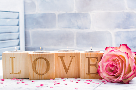 Romantic wooden candle holders with burning tea handles. Valentines day greeting cardの写真素材