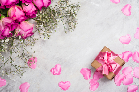 Beautiful roses on grey stone background. Valentines day or mothers day greeting cardの写真素材