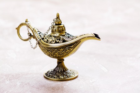 Aladdin magic lamp on the sandの写真素材