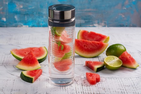 Homemade watermelon detox infused water on wooden backgroundの写真素材