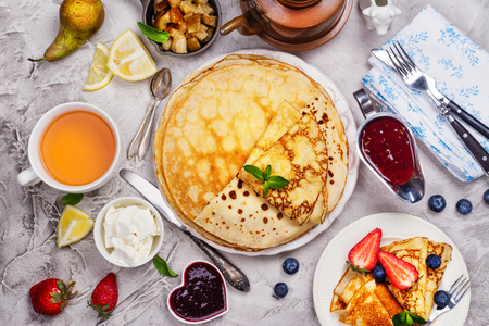 Colorful, tasty and savory breakfast with crepes and different fillings and saucesの写真素材