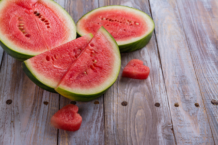 Fresh ripe watermelon slices and mint on wooden tableの写真素材