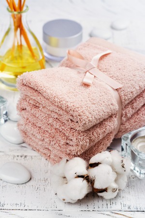 SPA or welness concept with cotton towels, soap and sea saltの写真素材