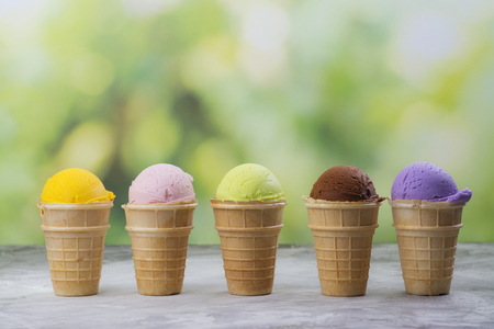 Assortment of natural ice cream - strawberry, chocolate, orange, blueberry and mintの写真素材