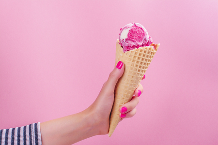 Woman hand holding ice creamの写真素材