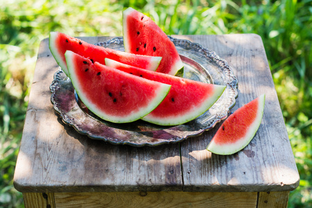 Watermelon slices in the gardenの写真素材