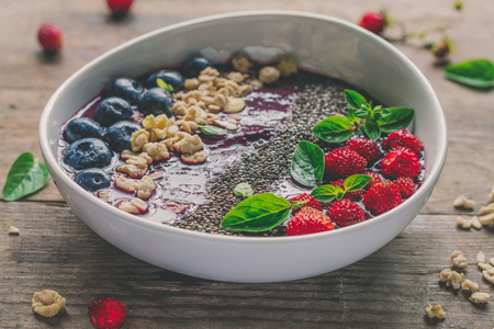 Berry purple smoothie bowlの写真素材