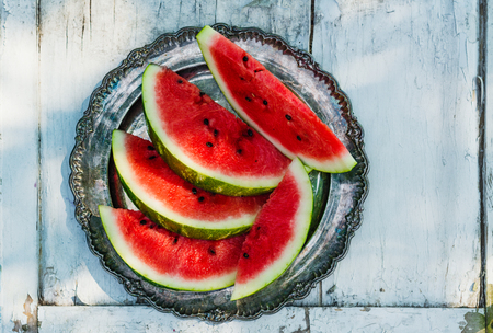 Watermelon slices in the gardenの写真素材