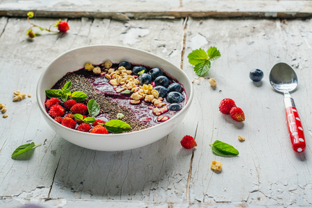Berry purple smoothie bowlの写真素材