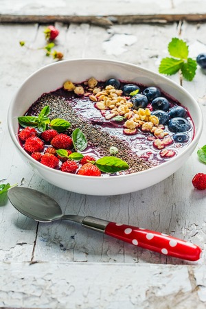 Berry purple smoothie bowlの写真素材