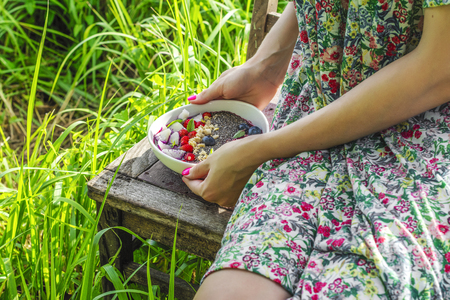 Woman holding smoothie bowlの写真素材