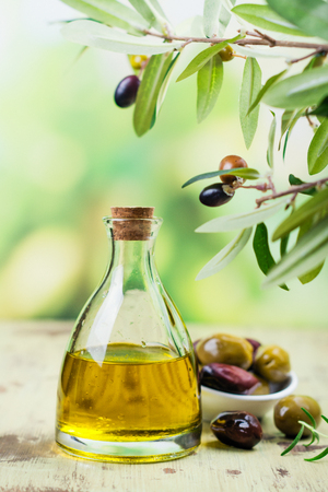 Olive oil in a glass bottleの写真素材