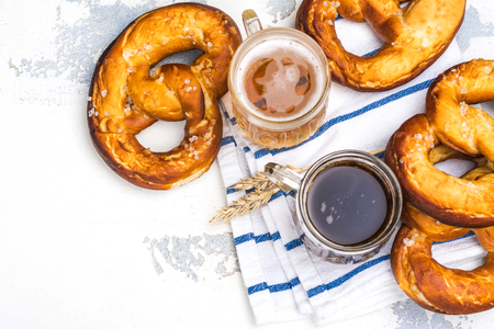 Beer and pretzels on whiteの写真素材