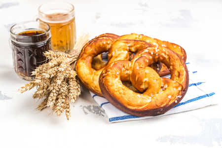 Beer and pretzels on whiteの写真素材