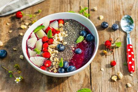 Berry purple smoothie bowlの写真素材