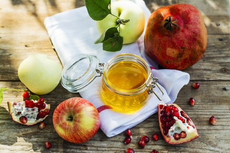 Apples, honey and pomegranateの写真素材