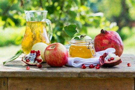 Apples, honey and pomegranateの写真素材