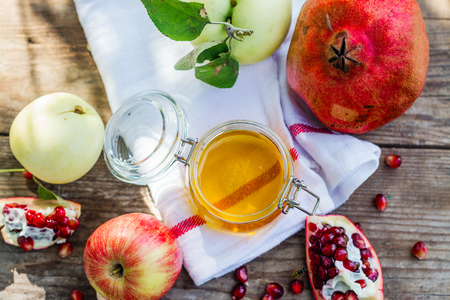Apples, honey and pomegranateの写真素材