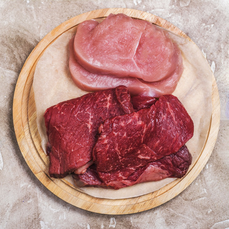 Raw turkey breast and beef meatの写真素材