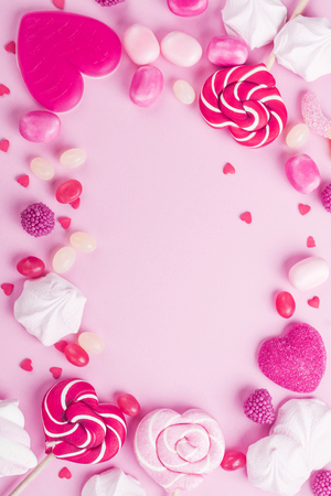 Candies, lollipops, jelly on pink backgroundの写真素材
