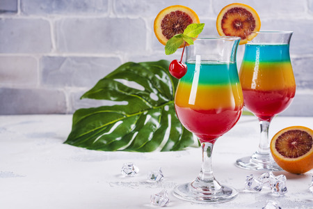 Summer rainbow layered cocktailの写真素材