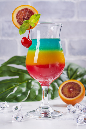 Summer rainbow layered cocktailの写真素材