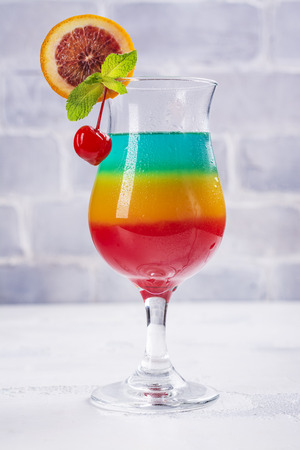 Summer rainbow layered cocktailの写真素材