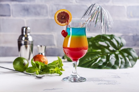 Summer rainbow layered cocktailの写真素材