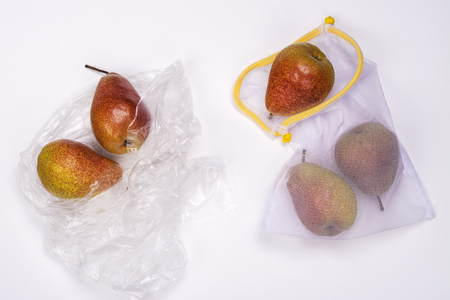 Fresh pears in eco and plastic bagsの写真素材